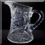 G22. American Brilliant Period cut glass pitcher. (Star design) 9”h - $60 